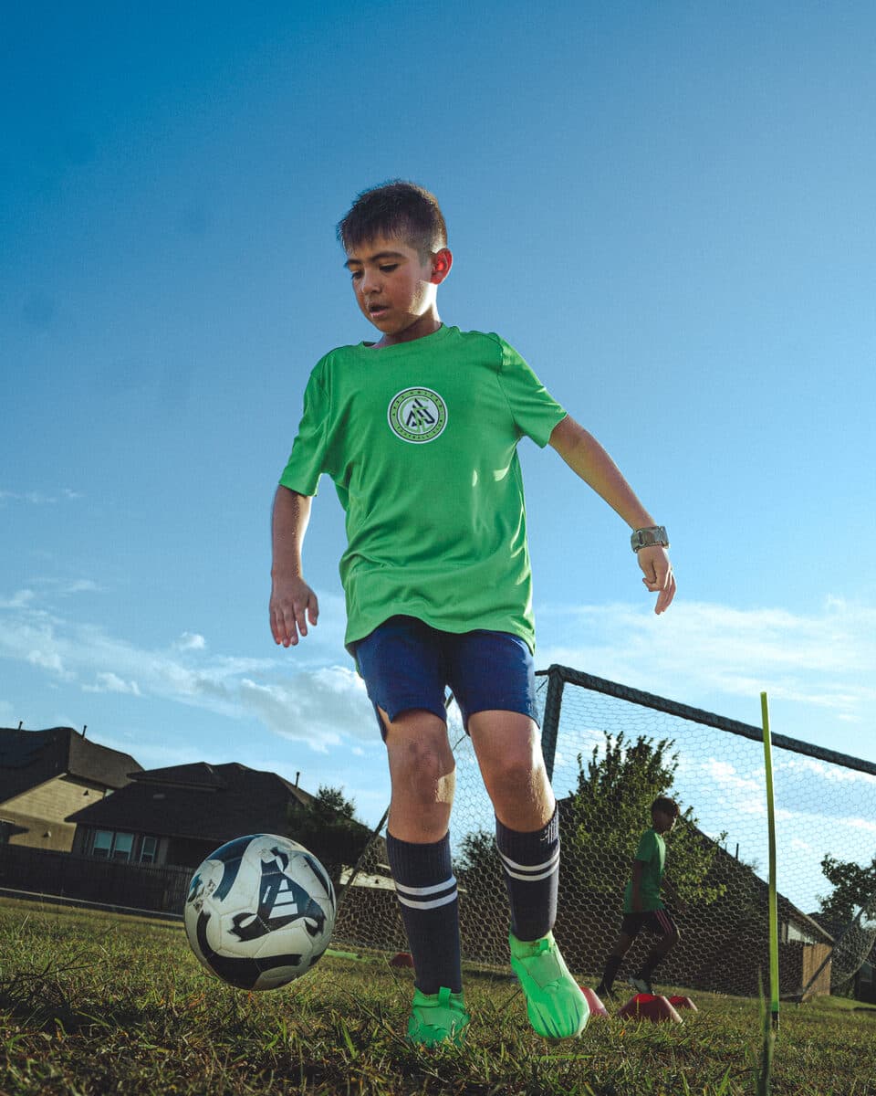 Apex United FC player working on ball control in San Antonio